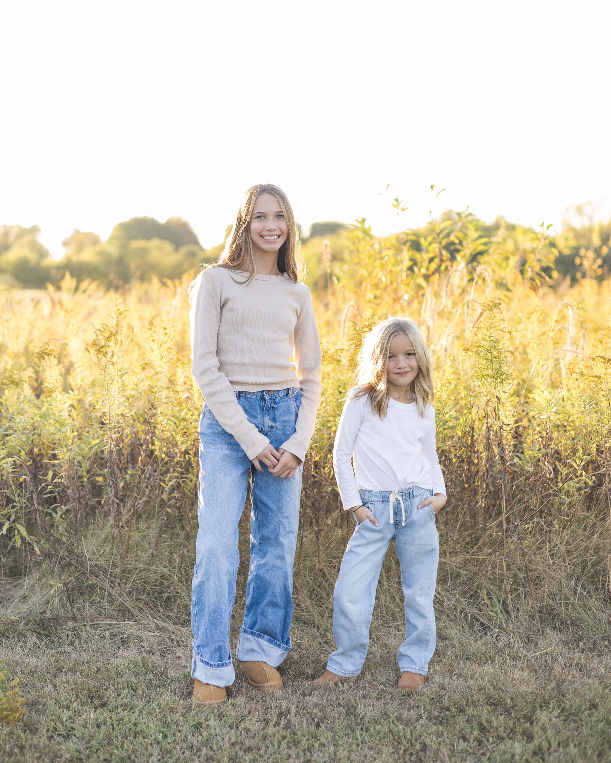 A teen girl in tan stands with her younger sisters on one of the kid-friendly trails in Springfield, IL